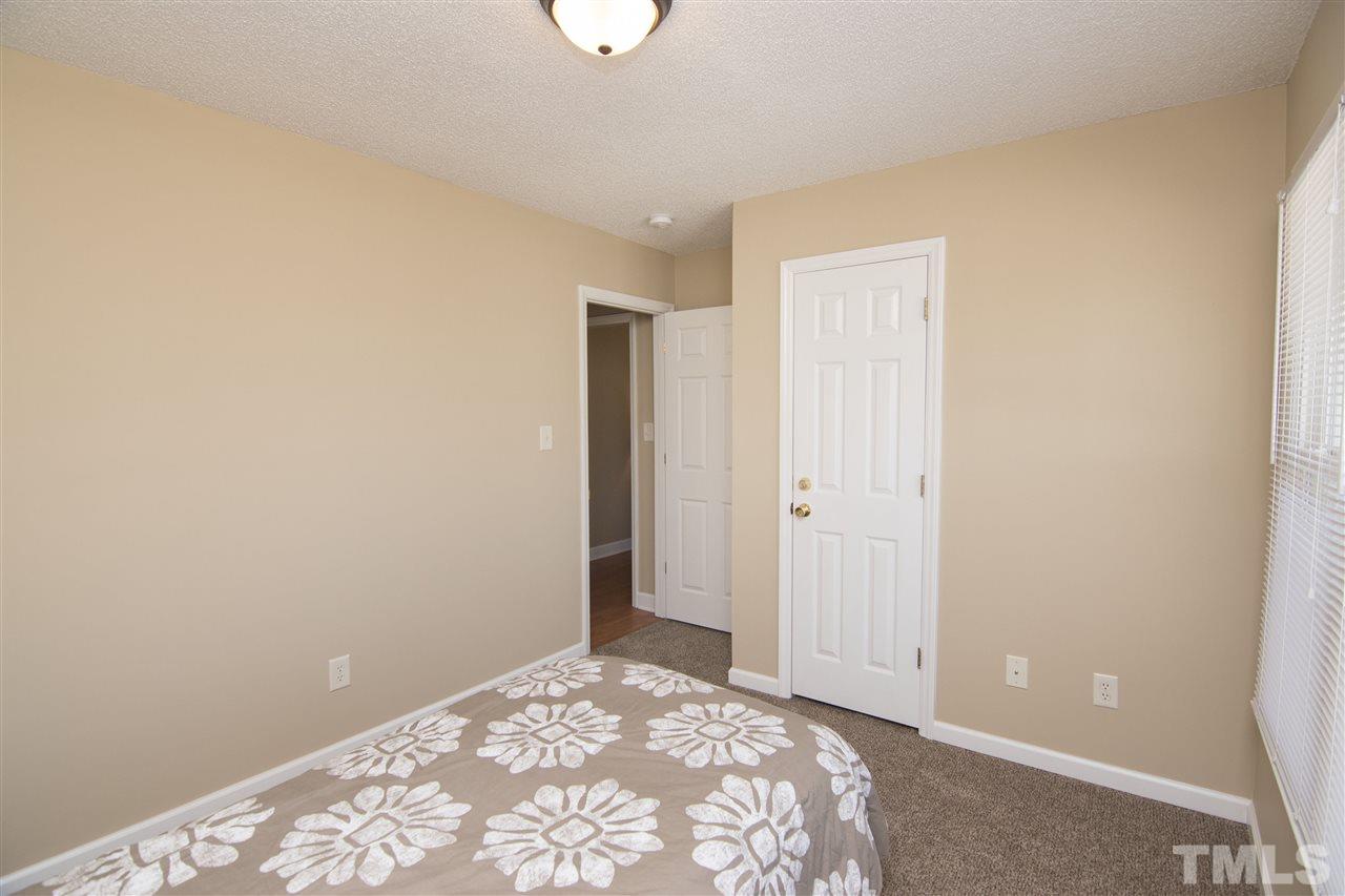 1849 Sanders Road Willow Spring, NC 27592 - Photo 12 of 25 a view of a bedroom with closet