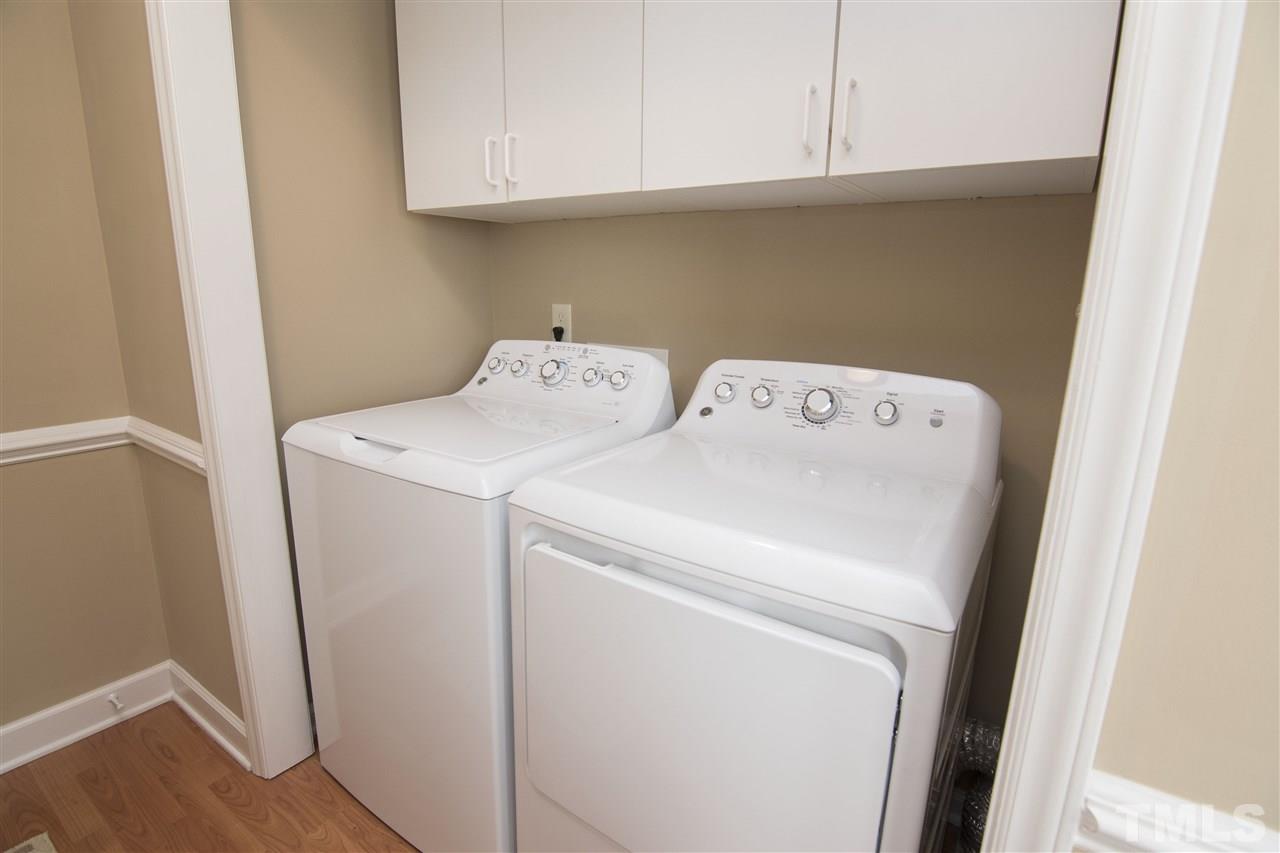 1849 Sanders Road Willow Spring, NC 27592 - Photo 19 of 25 a utility room with dryer and washer