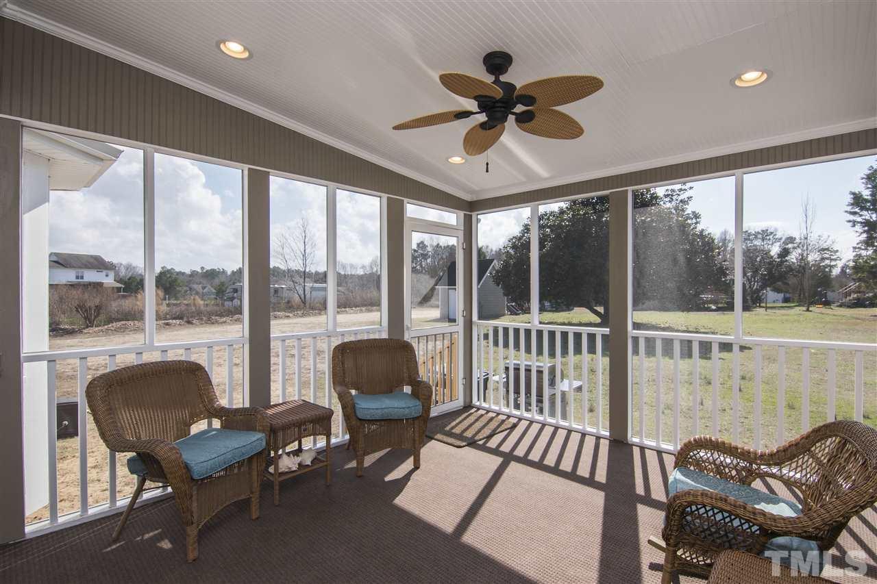 1849 Sanders Road Willow Spring, NC 27592 - Photo 21 of 25 a living room with furniture and a large window