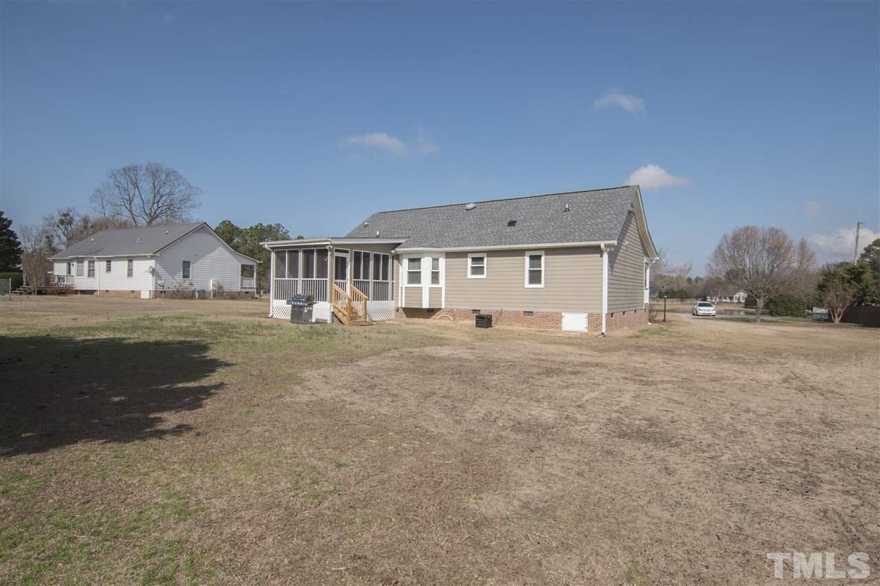 1849 Sanders Road Willow Spring, NC 27592 - Photo 24 of 25 a front view of a house with a yard
