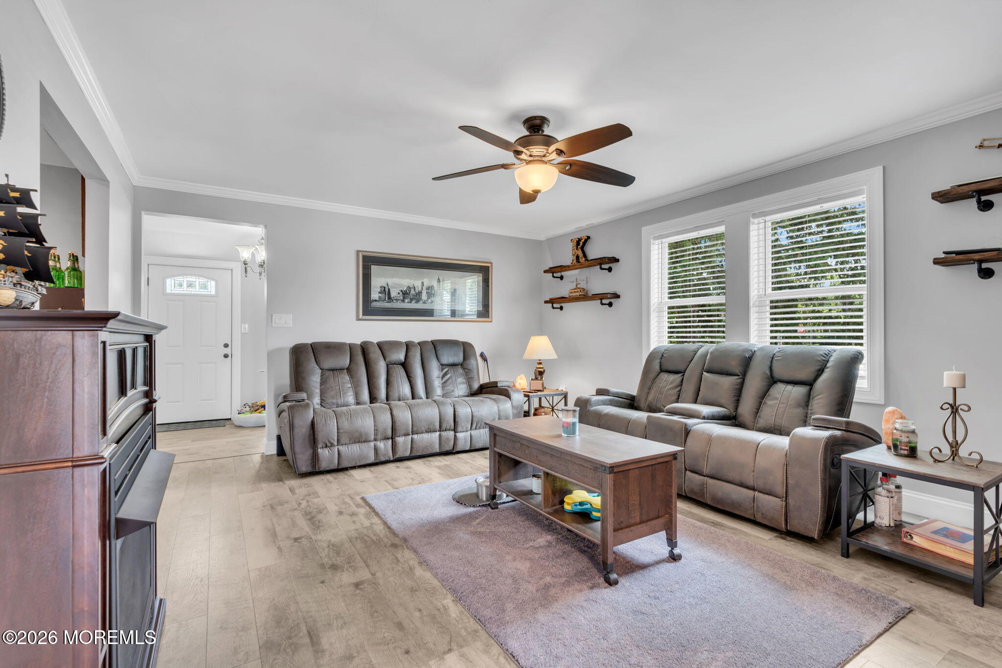 181 Locust Avenue Howell, NJ 07731 - Photo 11 of 66 a living room with furniture and a chandelier