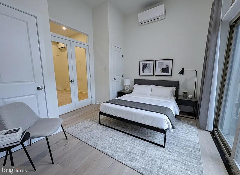 a bedroom with a bed and a chair