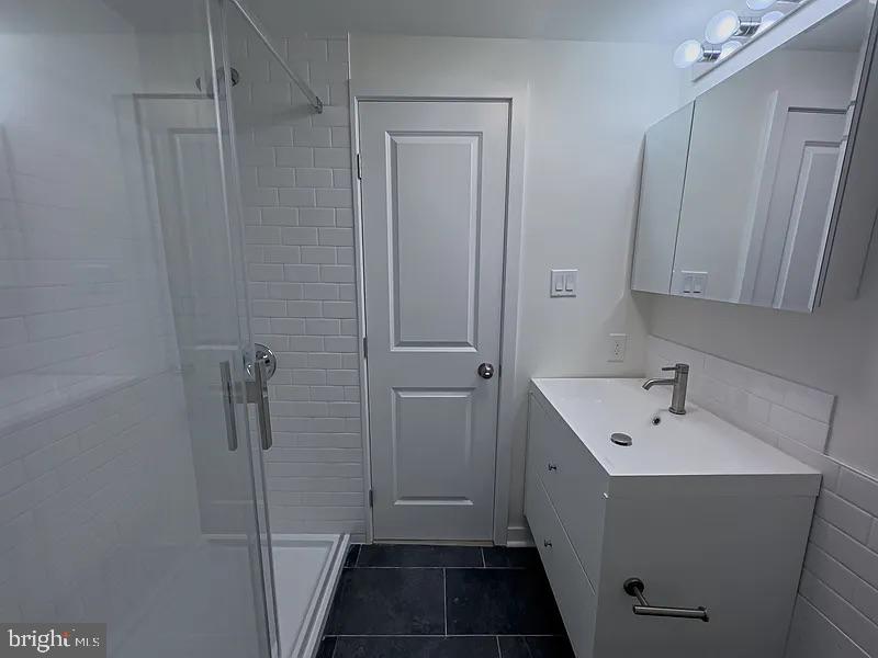 2011 Green Street, Unit 2R Philadelphia, PA 19130 - Photo 8 of 15 a bathroom with a sink and shower