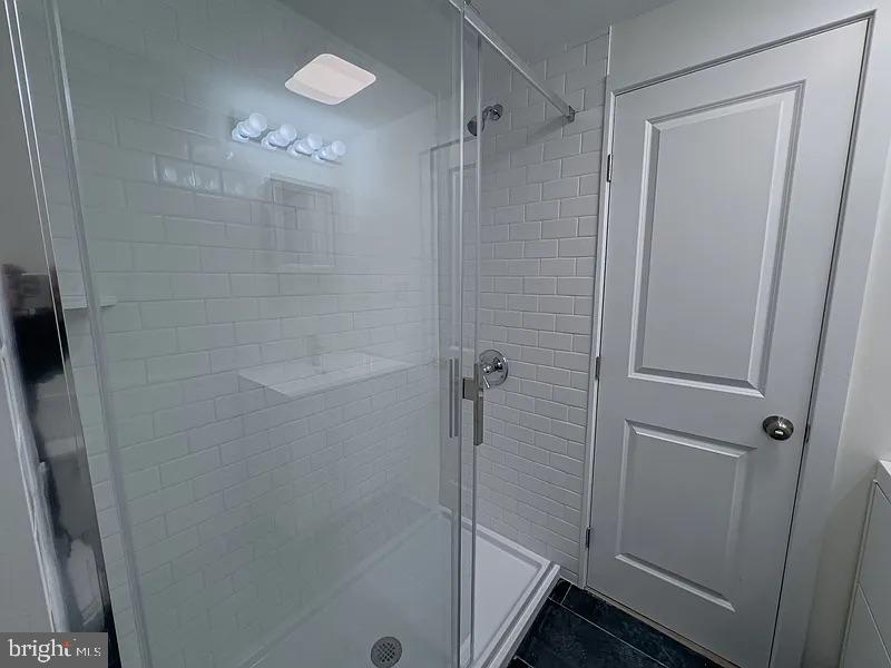 2011 Green Street, Unit 2R Philadelphia, PA 19130 - Photo 9 of 15 a bathroom with a glass shower door