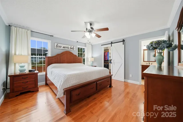 a bedroom with a bed dresser and a window