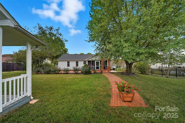 a view of a house with a yard porch and sitting area