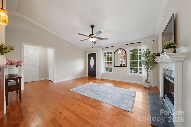 a view of workspace with fireplace and wooden floor