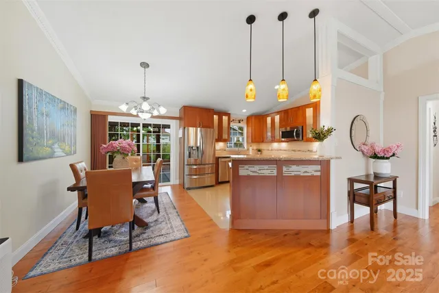 a living room with furniture a dining table and a fireplace