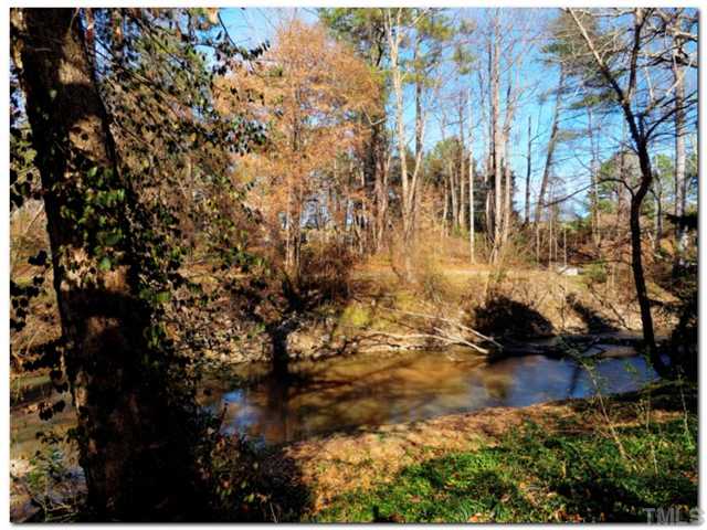5601 Shadowbrook Drive Raleigh, NC 27612 - Photo 22 of 23 Tranquil creek view from the deck and patio!!