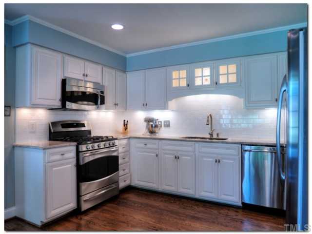 5601 Shadowbrook Drive Raleigh, NC 27612 - Photo 5 of 23 What a joy to cook in this kitchen!! Gas range, stainless steel appliances, granite countertops, subway tile backsplash, and a "pass though" to the dining room!!