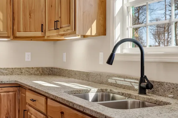 a kitchen with a sink and a window