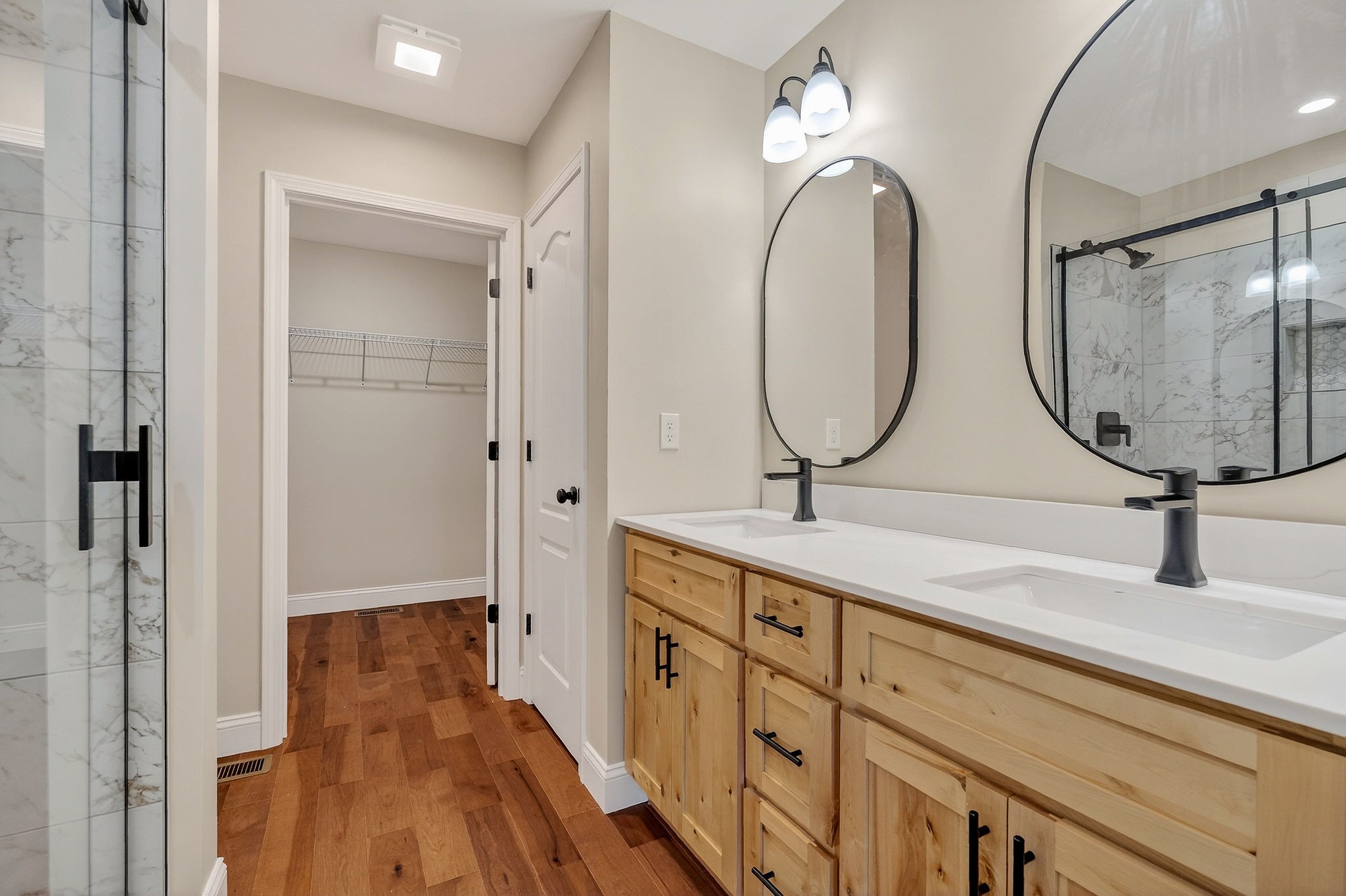270 Rich Loop Sparta, TN 38583 - Photo 24 of 41 a bathroom with a double vanity sink and a mirror