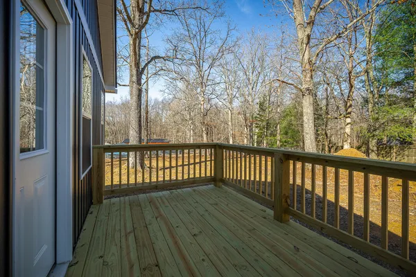 a view of balcony with wooden floor