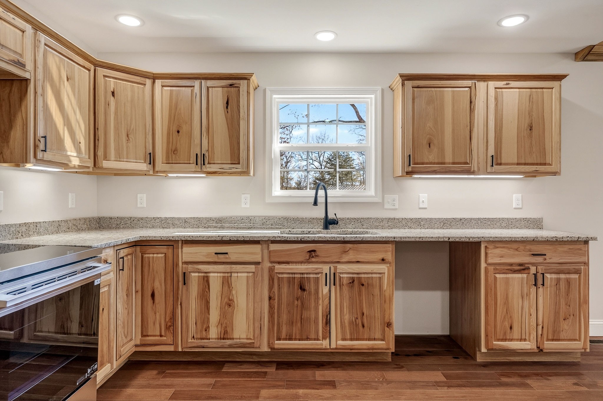 270 Rich Loop Sparta, TN 38583 - Photo 6 of 41 a kitchen with stainless steel appliances granite countertop a sink a stove and a microwave