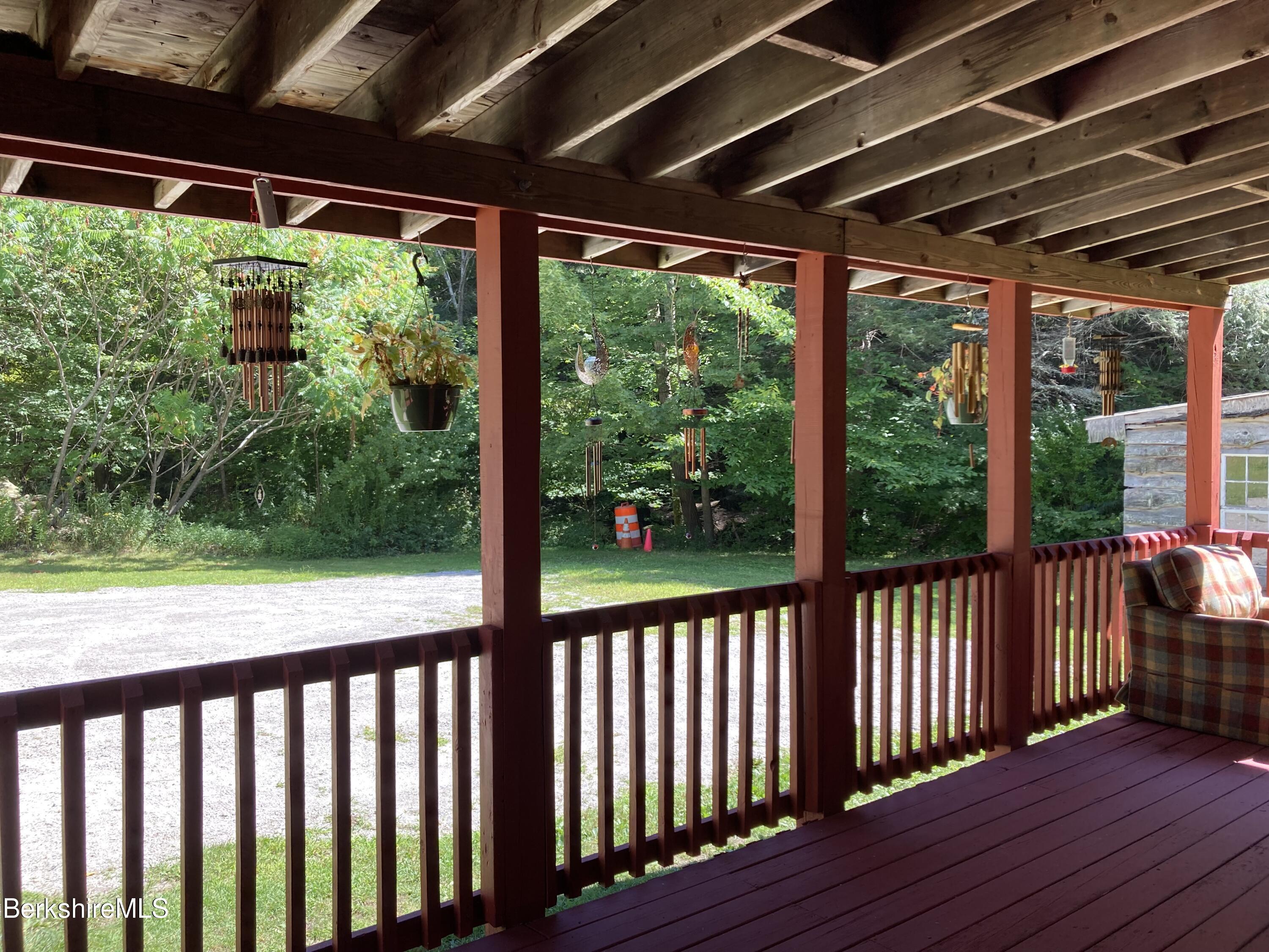 105 County Road Becket, MA 01223 - Photo 10 of 69 a view of a deck with wooden floor and outdoor space