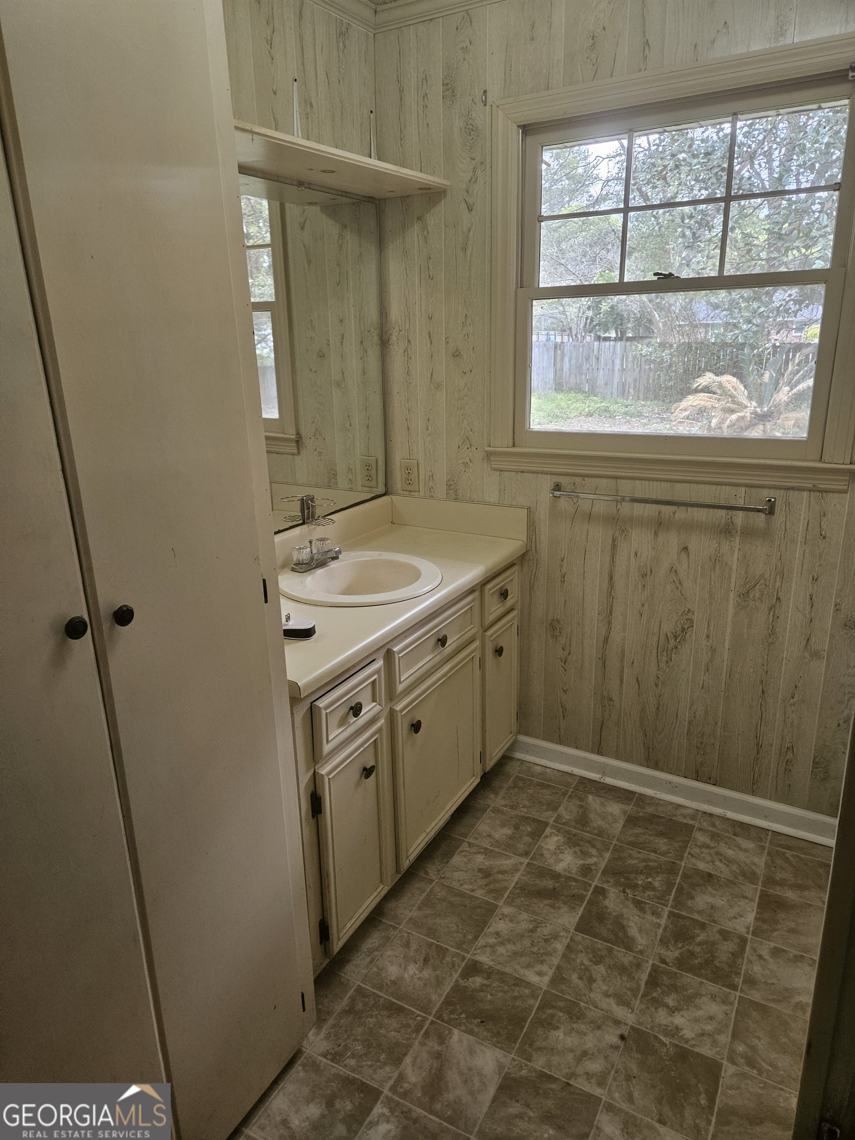 846 Harvey Street Millen, GA 30442 - Photo 17 of 34 a bathroom with a granite countertop sink a toilet and a shower