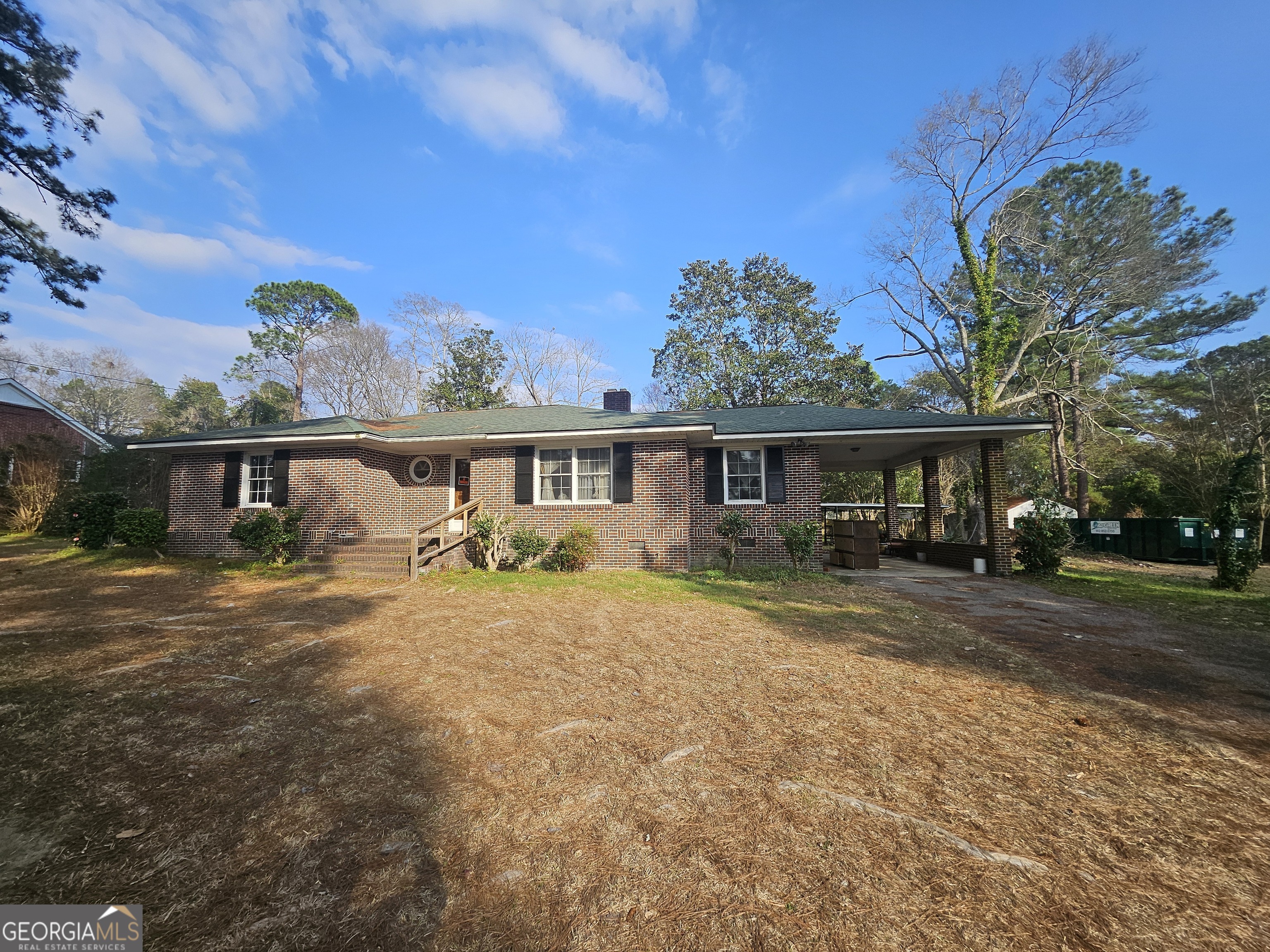 846 Harvey Street Millen, GA 30442 - Photo 2 of 34 a view of a yard in front of a house with large tree