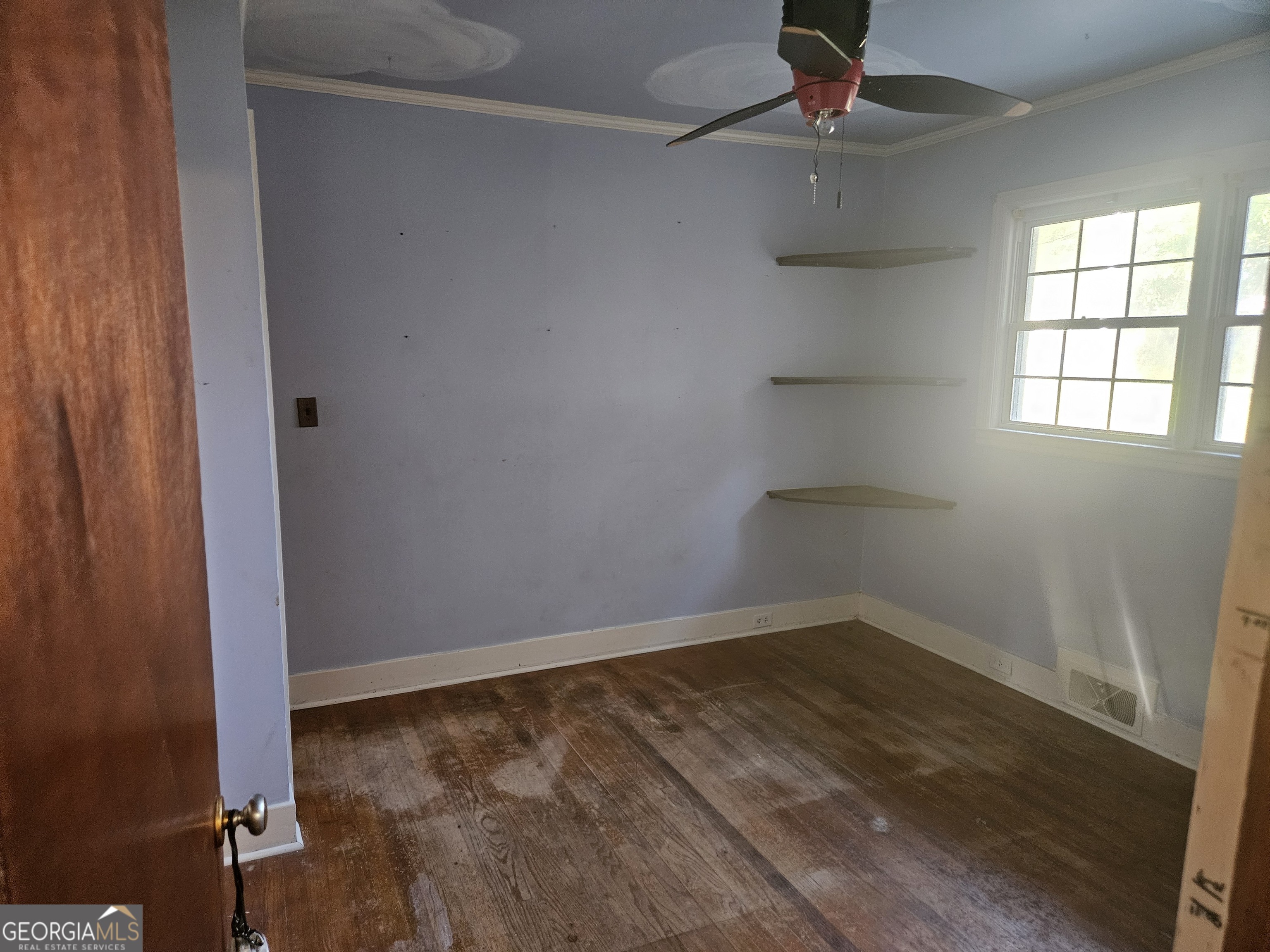 846 Harvey Street Millen, GA 30442 - Photo 21 of 34 an empty room with a window