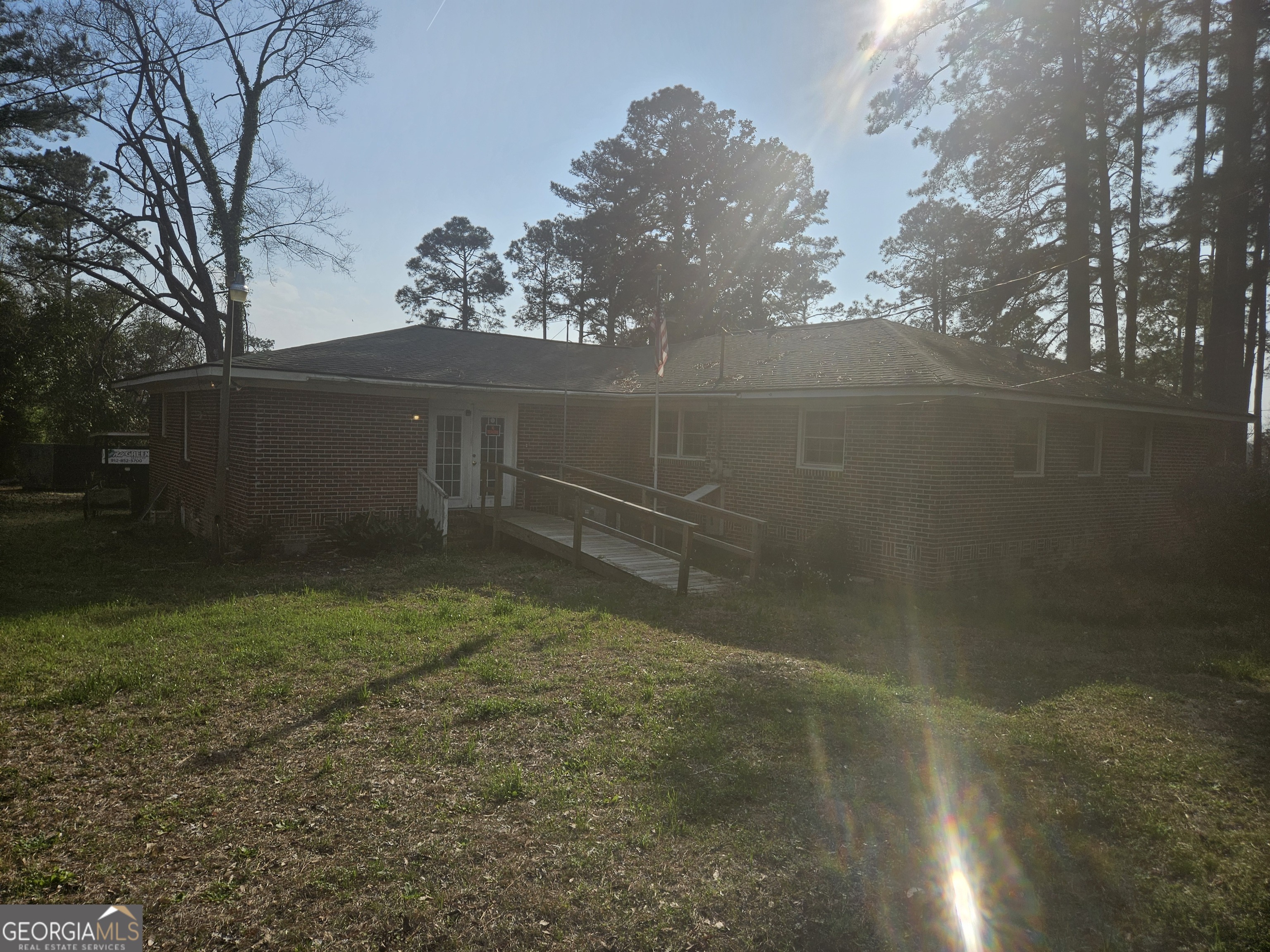 846 Harvey Street Millen, GA 30442 - Photo 29 of 34 a backyard of a house with lots of green space
