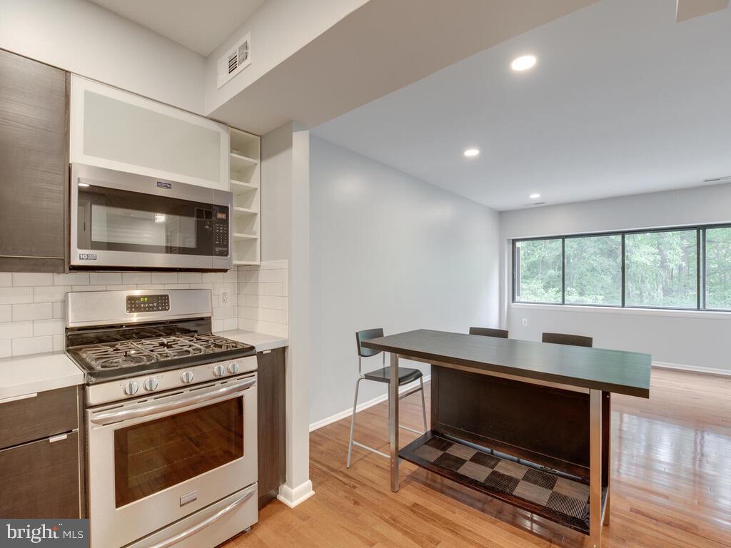 200 Cross Keys Road, Unit R35 Baltimore, MD 21210 - Photo 7 of 35 Microwave and gas stove