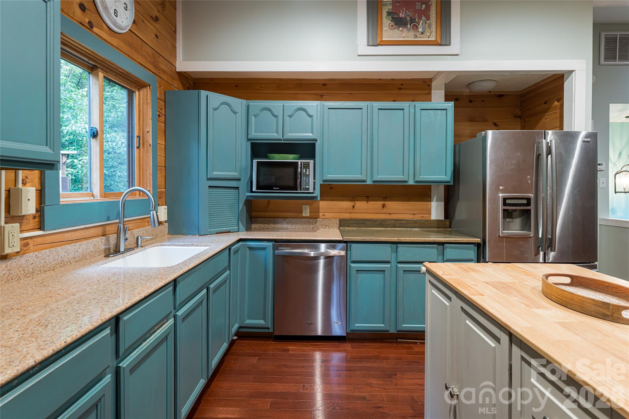 4035 Bald Creek Road Clyde, NC 28721 - Photo 13 of 43 a kitchen with stainless steel appliances a sink stove and refrigerator
