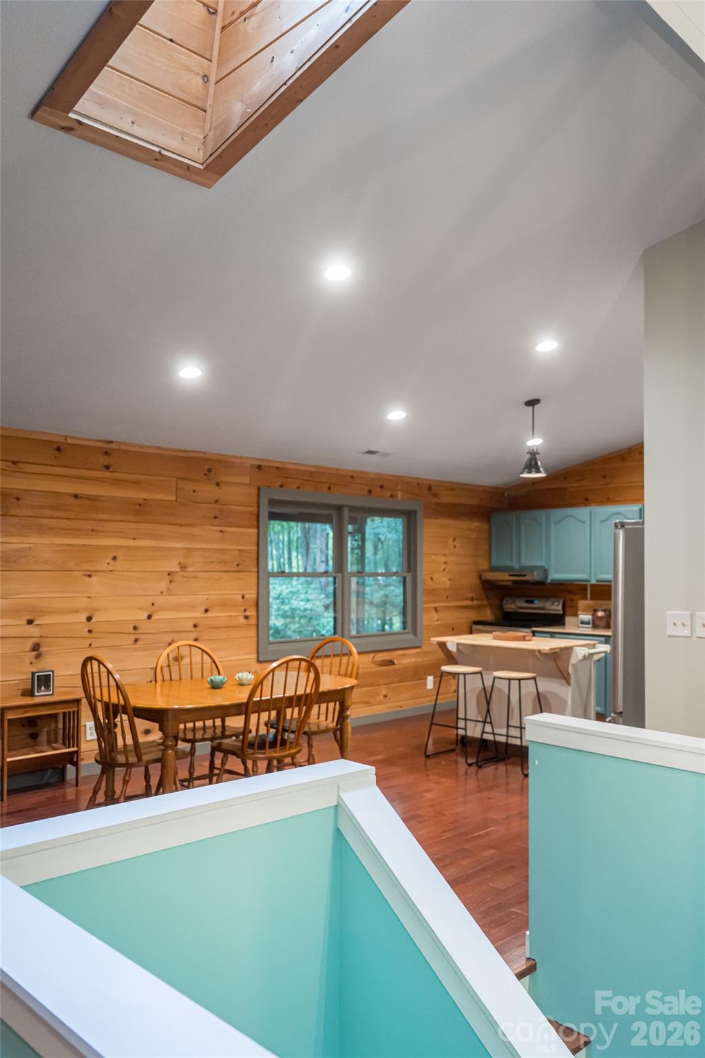 4035 Bald Creek Road Clyde, NC 28721 - Photo 14 of 43 a kitchen with stainless steel appliances granite countertop a stove and a sink with cabinets