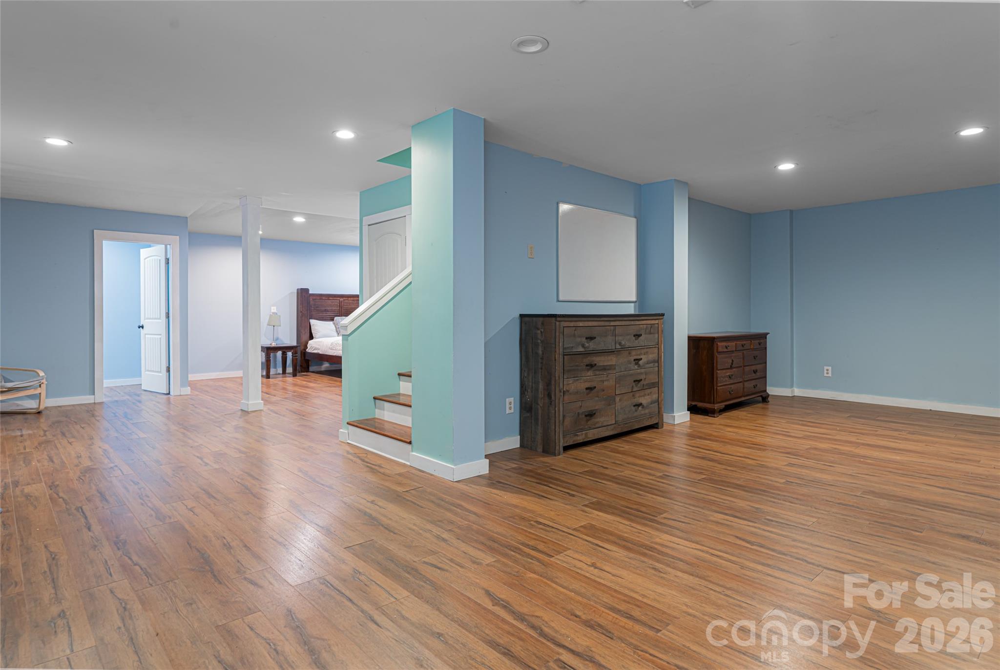4035 Bald Creek Road Clyde, NC 28721 - Photo 22 of 43 a view of kitchen with kitchen island wooden floor and living room