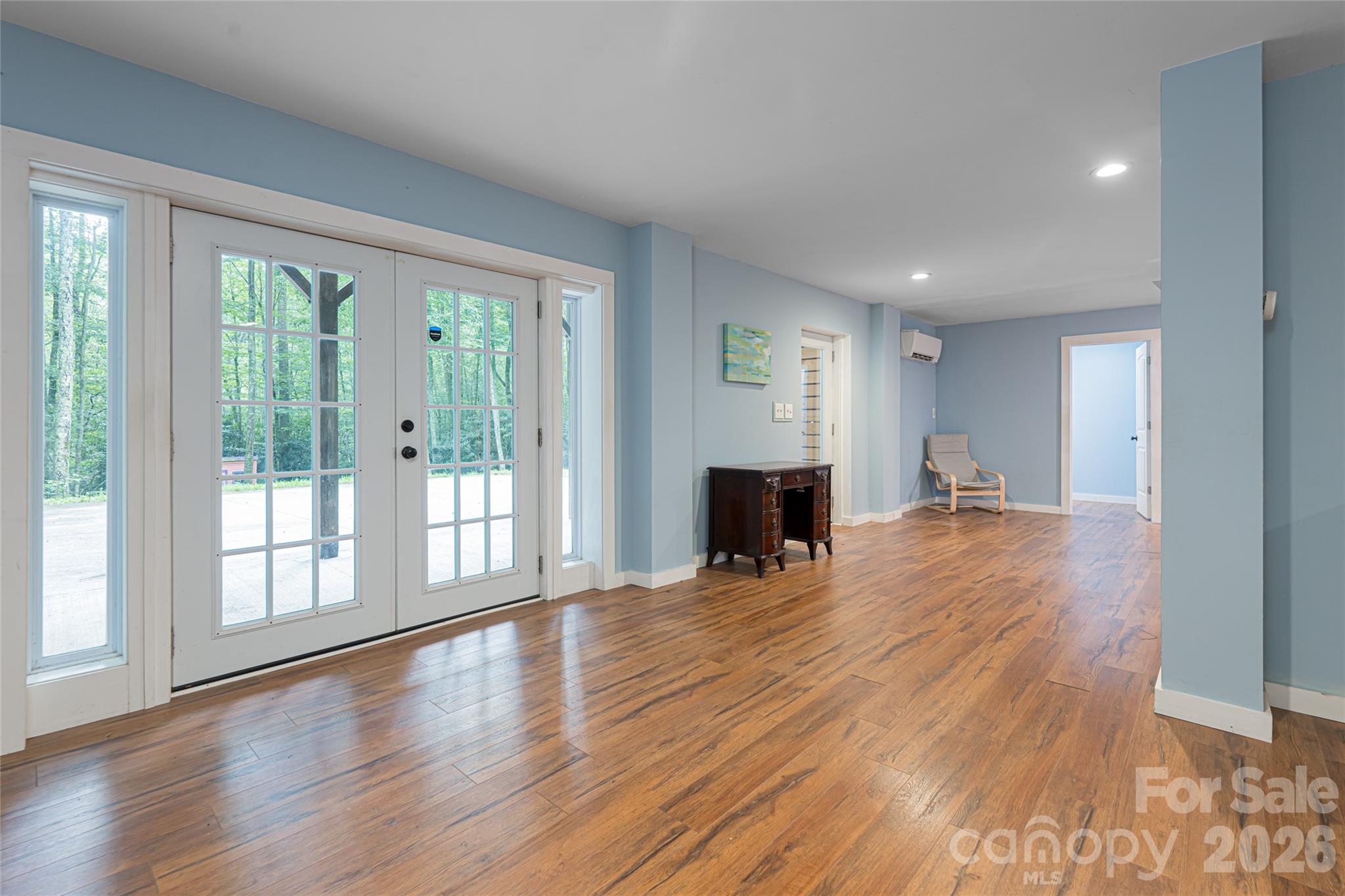4035 Bald Creek Road Clyde, NC 28721 - Photo 23 of 43 a view of empty room with wooden floor and fireplace