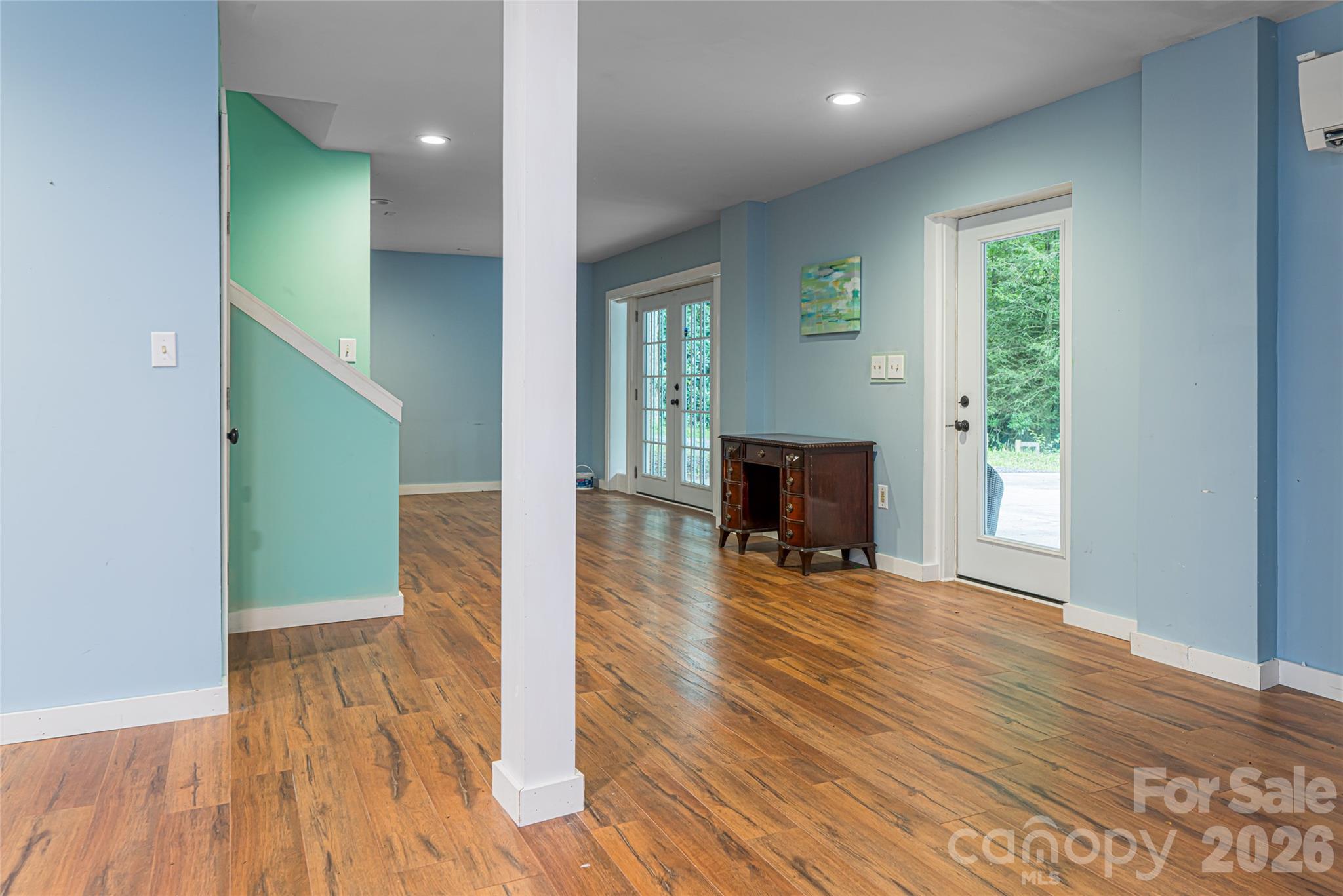 4035 Bald Creek Road Clyde, NC 28721 - Photo 24 of 43 a view of a livingroom with wooden floor and a fireplace