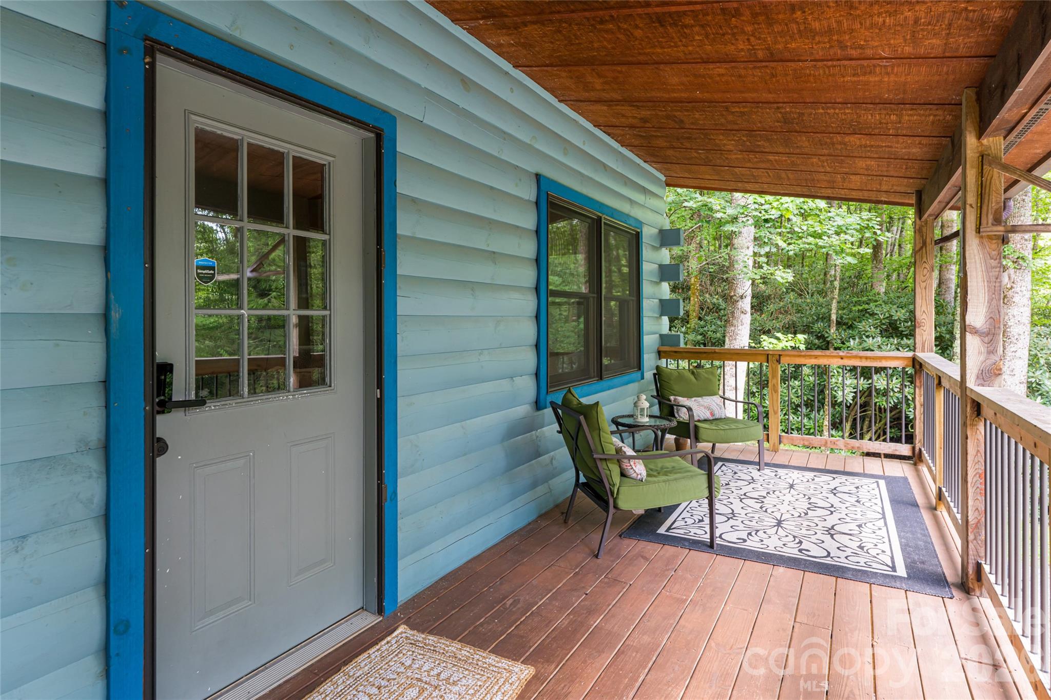 4035 Bald Creek Road Clyde, NC 28721 - Photo 6 of 43 a view of two chairs in the balcony