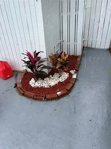 a view of a room with a table and chairs