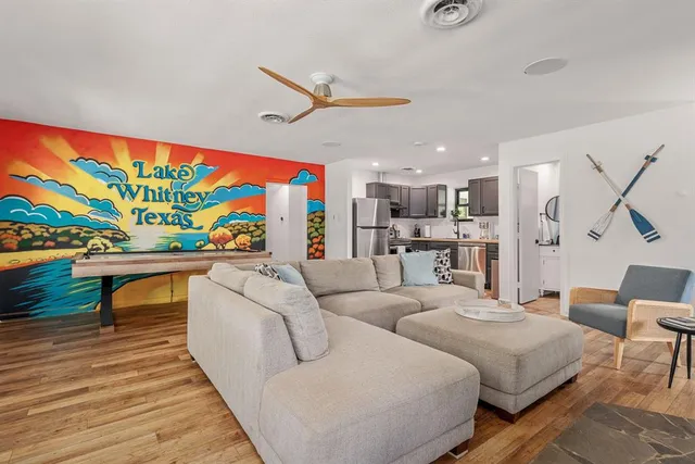 a bedroom with furniture and a wooden floor