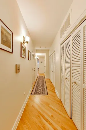 a view of a hallway with a wooden floor