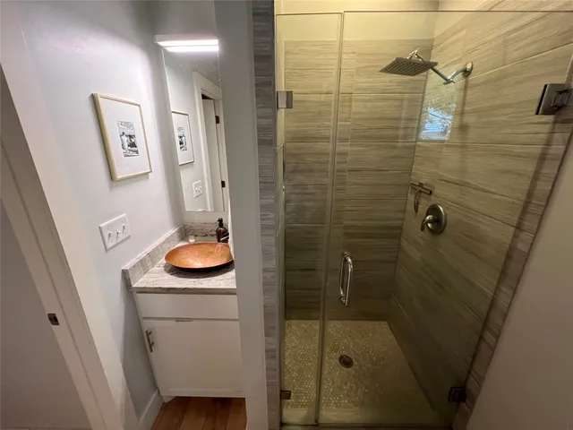 a bathroom with a sink and mirror
