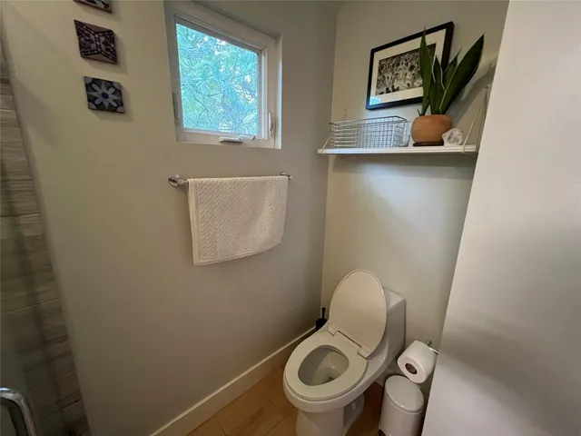 a bathroom with a toilet and a sink