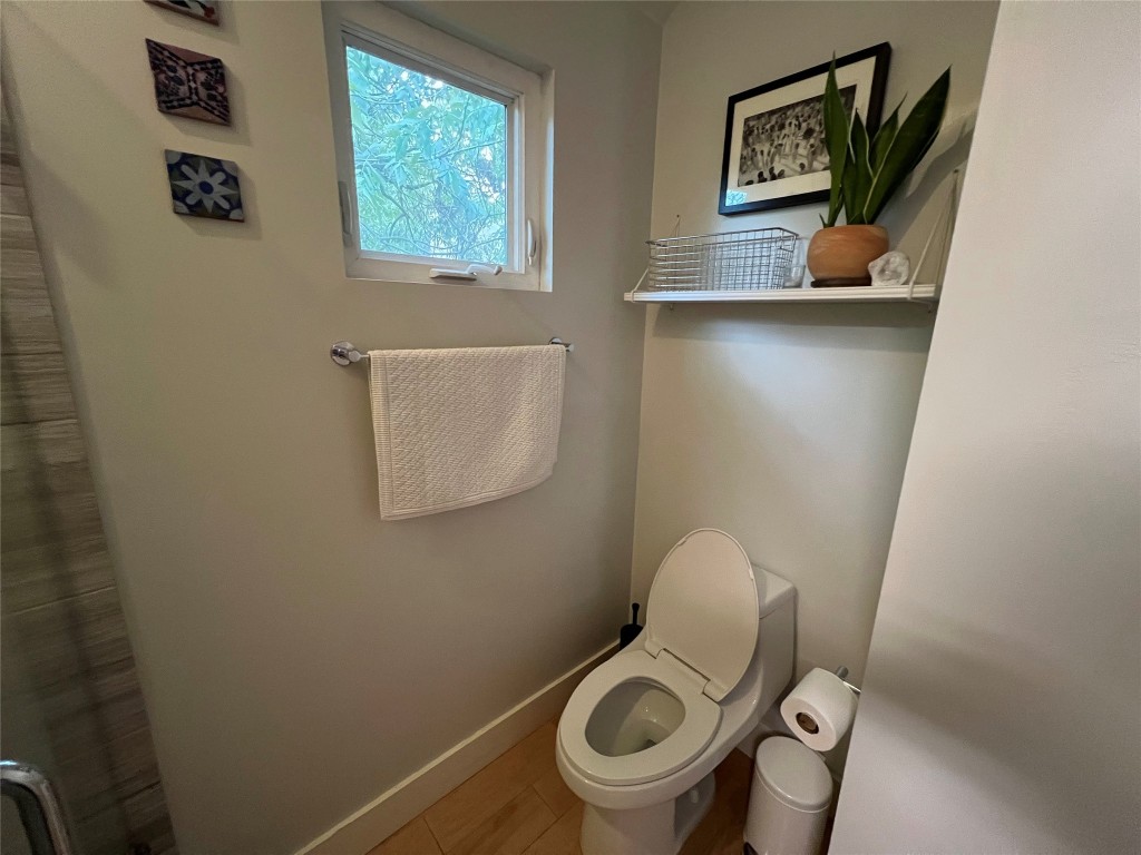 2206 East 9th Street, Unit B Austin, TX 78702 - Photo 13 of 15 a bathroom with a toilet and a sink