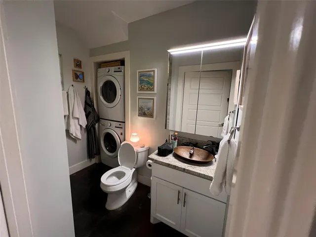 a close view of a sink and cabinets