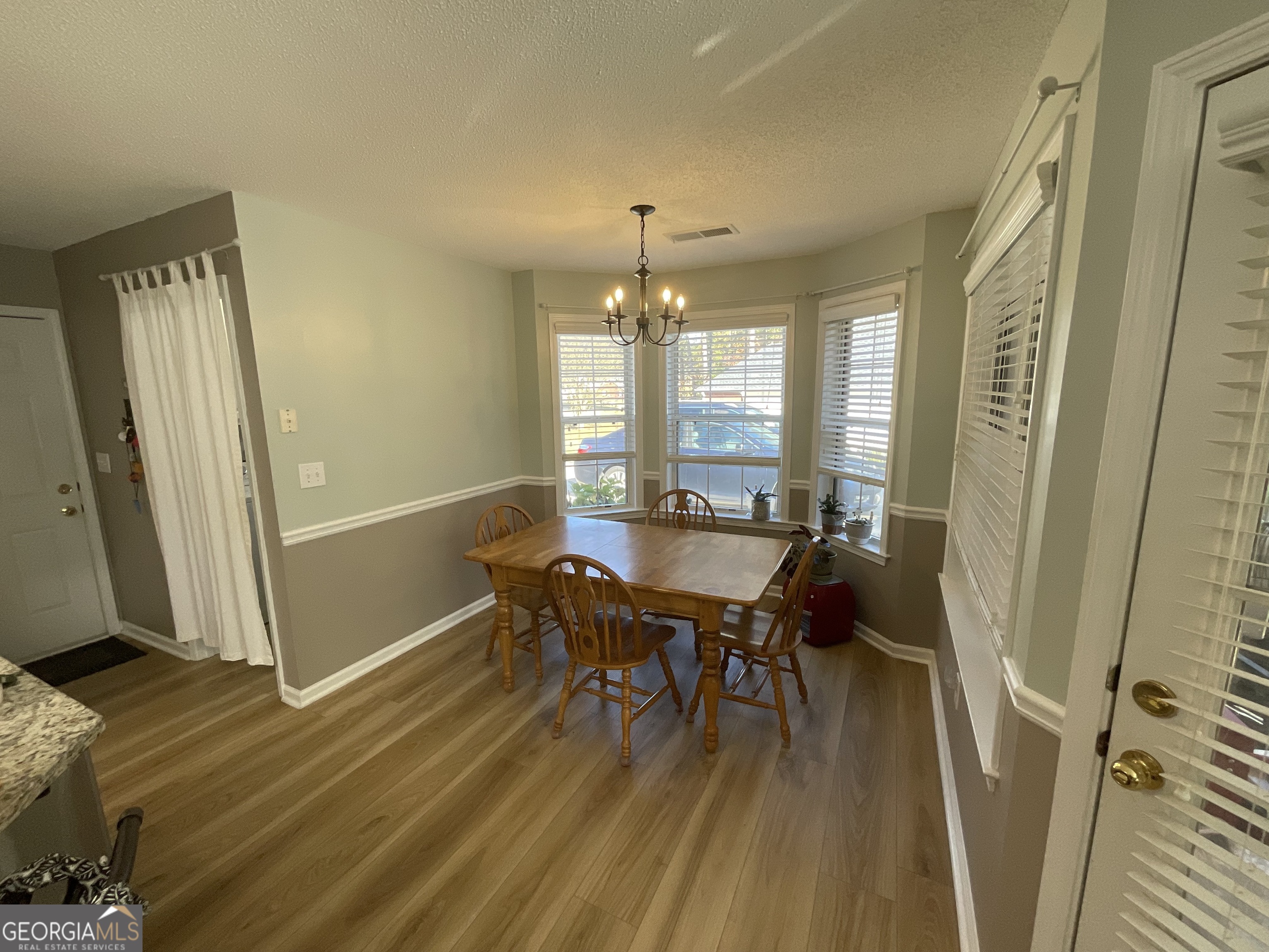 45 Riverside Walk Sharpsburg, GA 30277 - Photo 12 of 25 a dining room with furniture and window