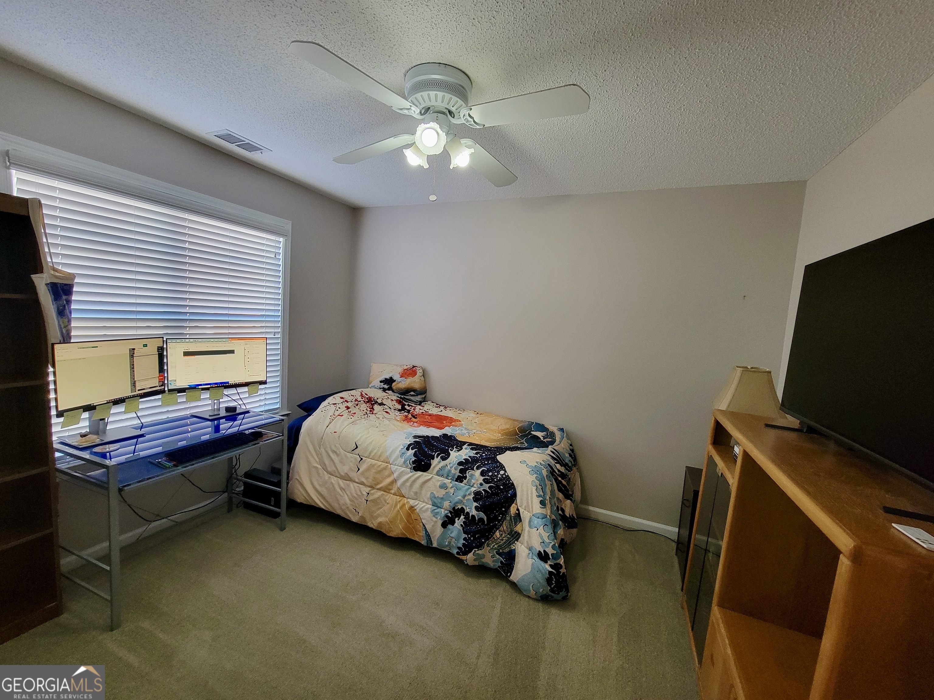 45 Riverside Walk Sharpsburg, GA 30277 - Photo 18 of 25 a bedroom with bed and a window