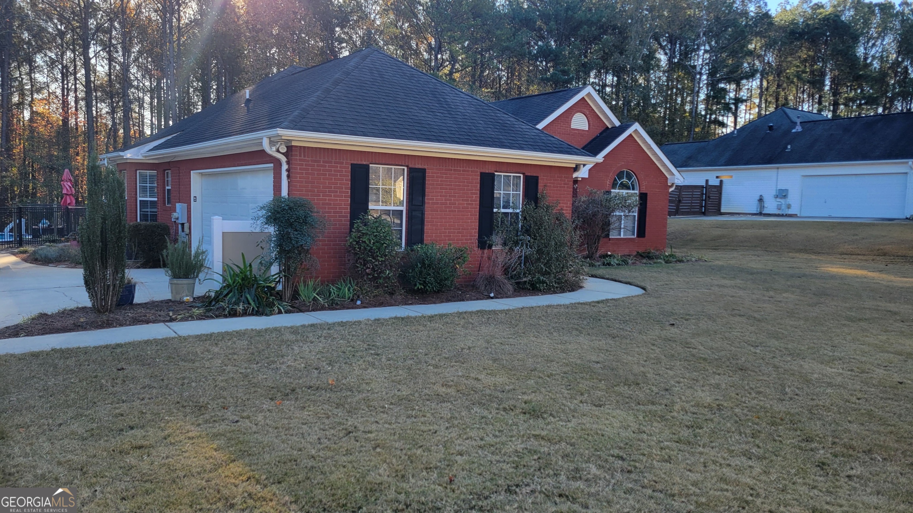 45 Riverside Walk Sharpsburg, GA 30277 - Photo 2 of 25 a front view of a house with garden