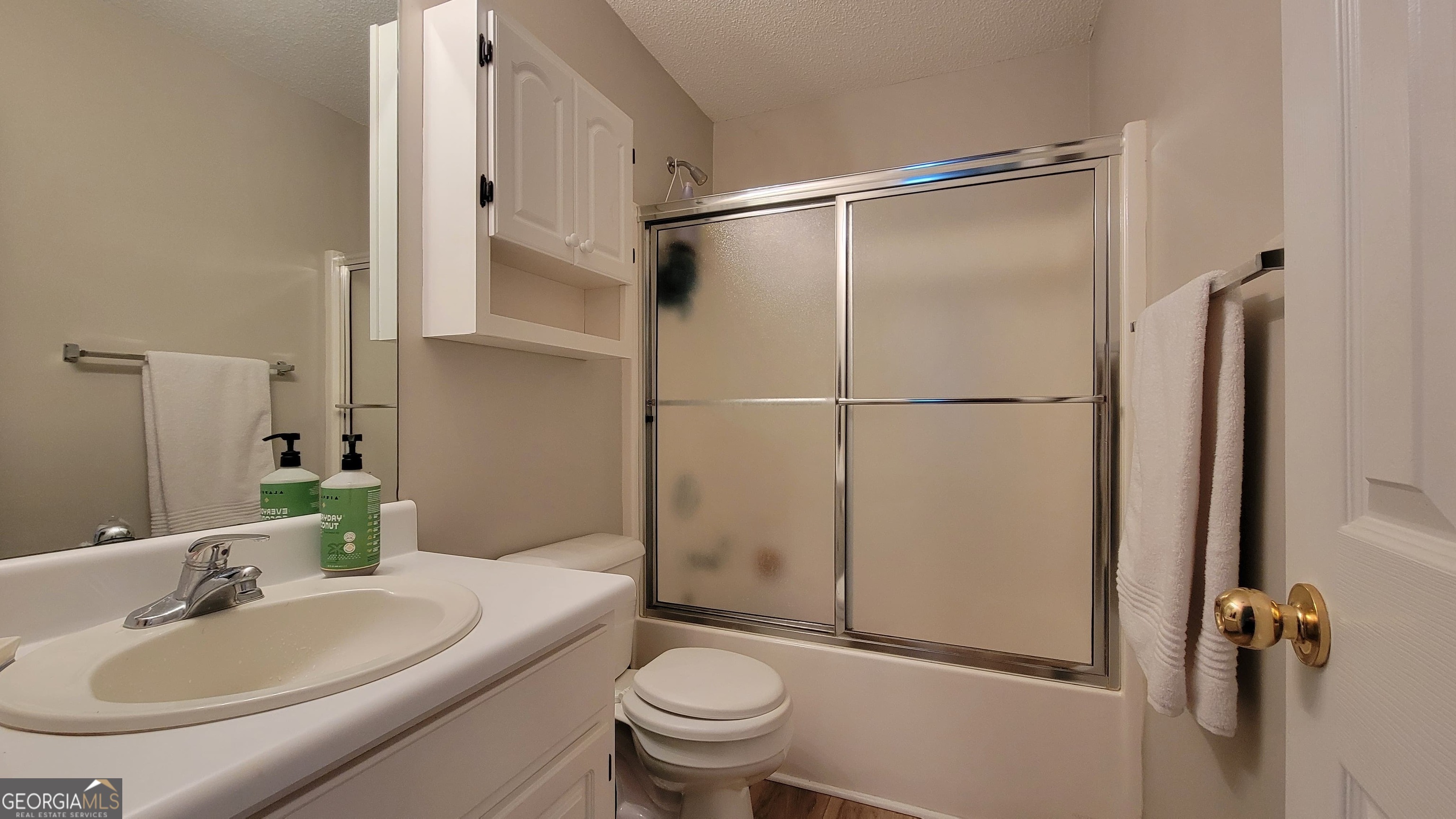 45 Riverside Walk Sharpsburg, GA 30277 - Photo 24 of 25 a bathroom with a sink toilet and shower