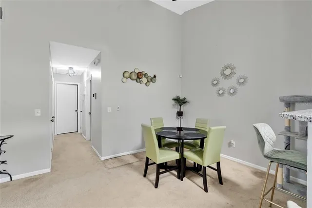 a view of a workspace with furniture and wooden floor