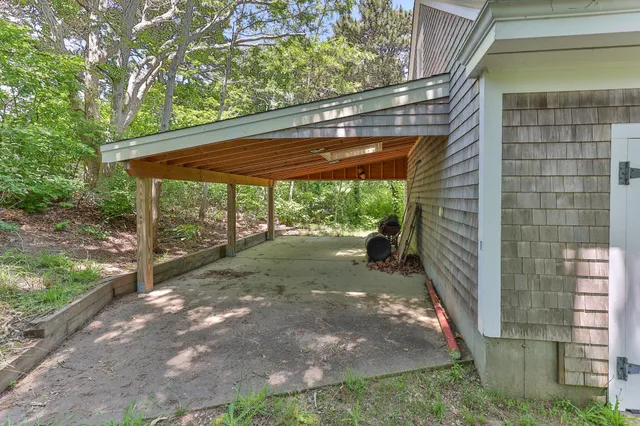 a view of house with yard and green space