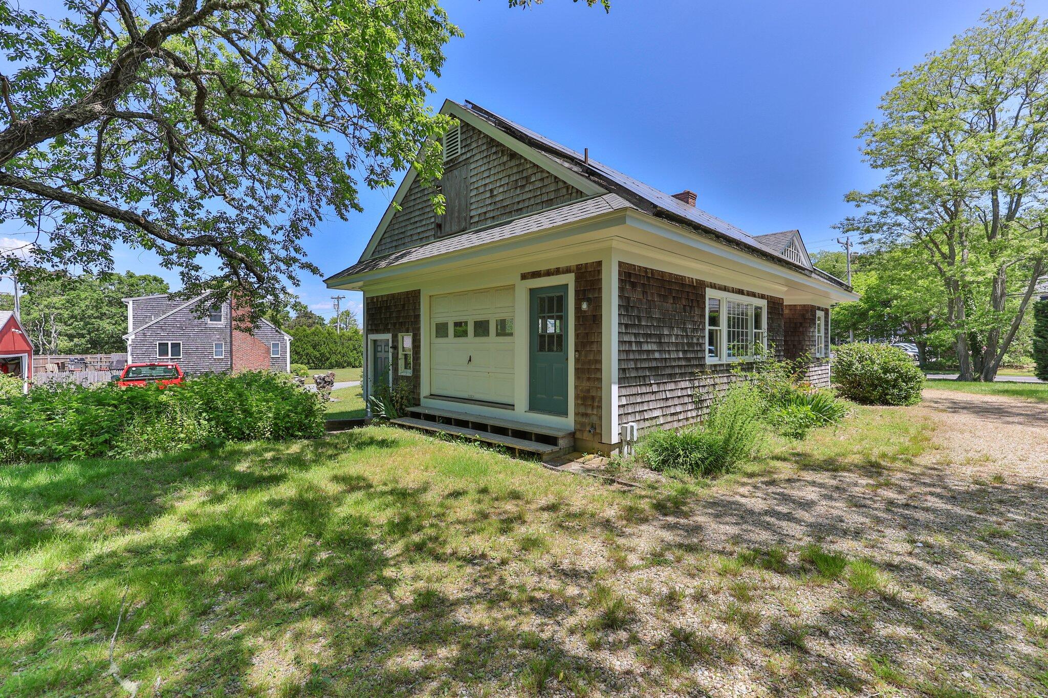 231 Crowell Road Chatham, MA 02633 - Photo 2 of 27 a view of a house with yard and plants