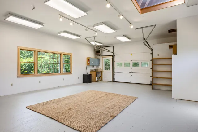 a view of an empty room and a window