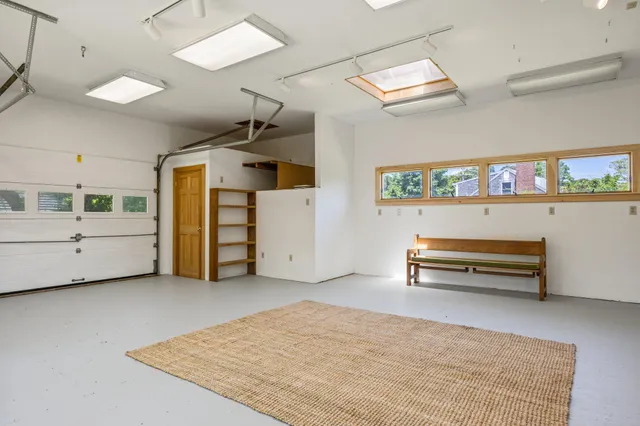a view of a livingroom with furniture and a window