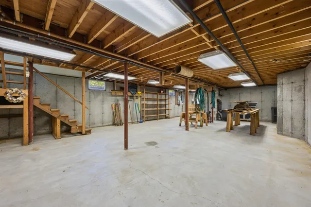 a view of empty room with wooden ceiling