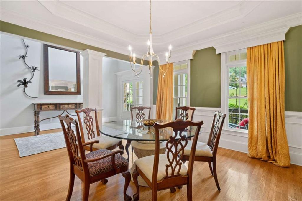 380 Creek Point Milton, GA 30004 - Photo 11 of 74 a view of a dining room with furniture window and wooden floor