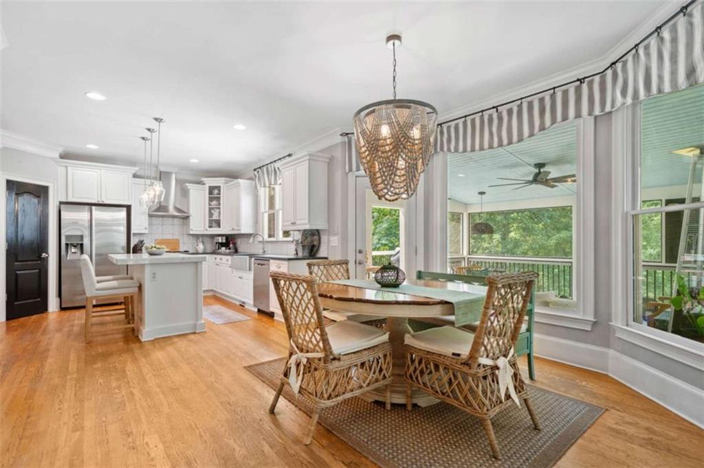 380 Creek Point Milton, GA 30004 - Photo 16 of 74 a view of a dining room with furniture window and wooden floor
