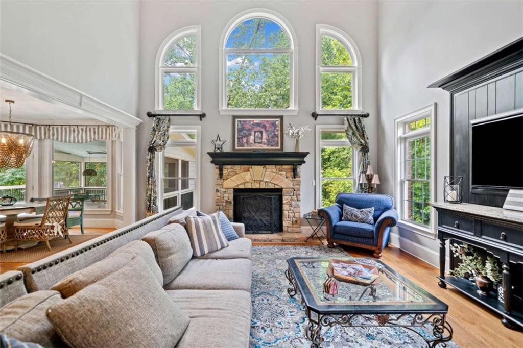 380 Creek Point Milton, GA 30004 - Photo 17 of 74 a living room with furniture a large window and a flat screen tv